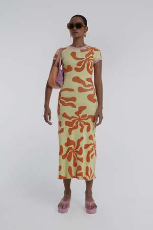 Arthur Apparel Hole Dress in Tequila Sunrise. Midi dress in yellow and orange for hire.