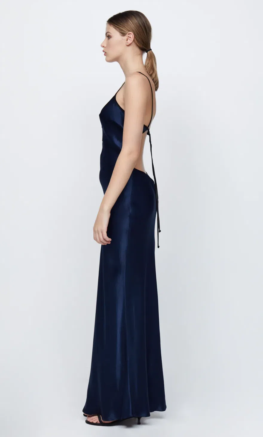 Hire the Bec and Bridge Cedar City Maxi Dress. A navy silk satin deep V dress with open back.