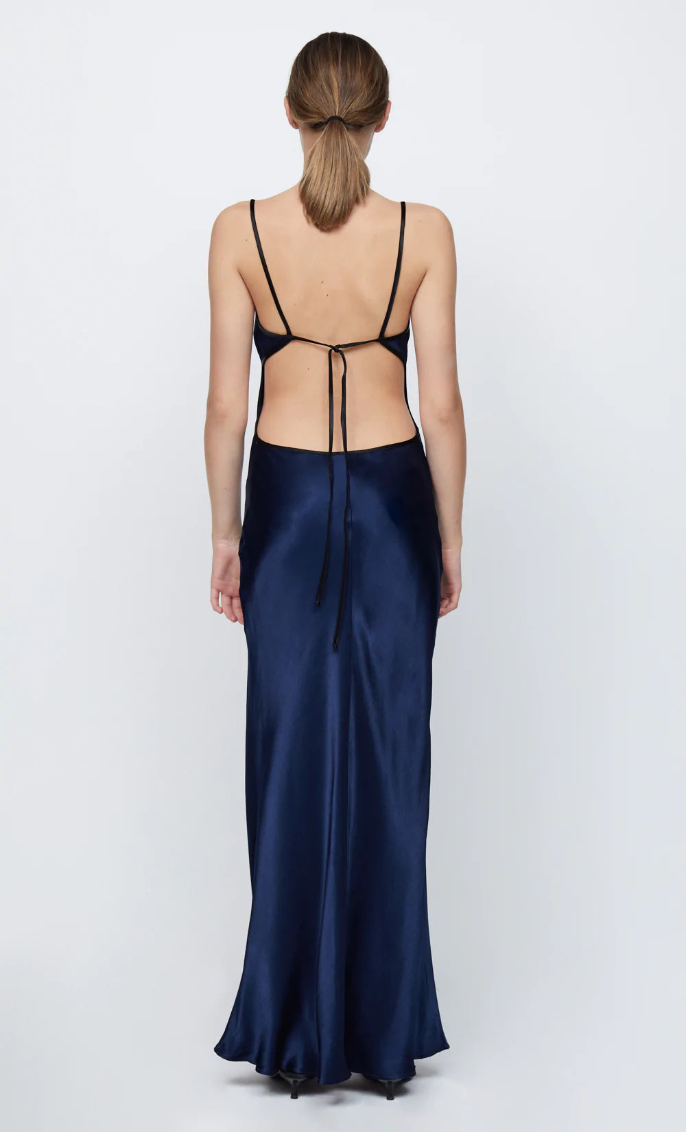 Hire the Bec and Bridge Cedar City Maxi Dress. A navy silk satin deep V dress with open back.