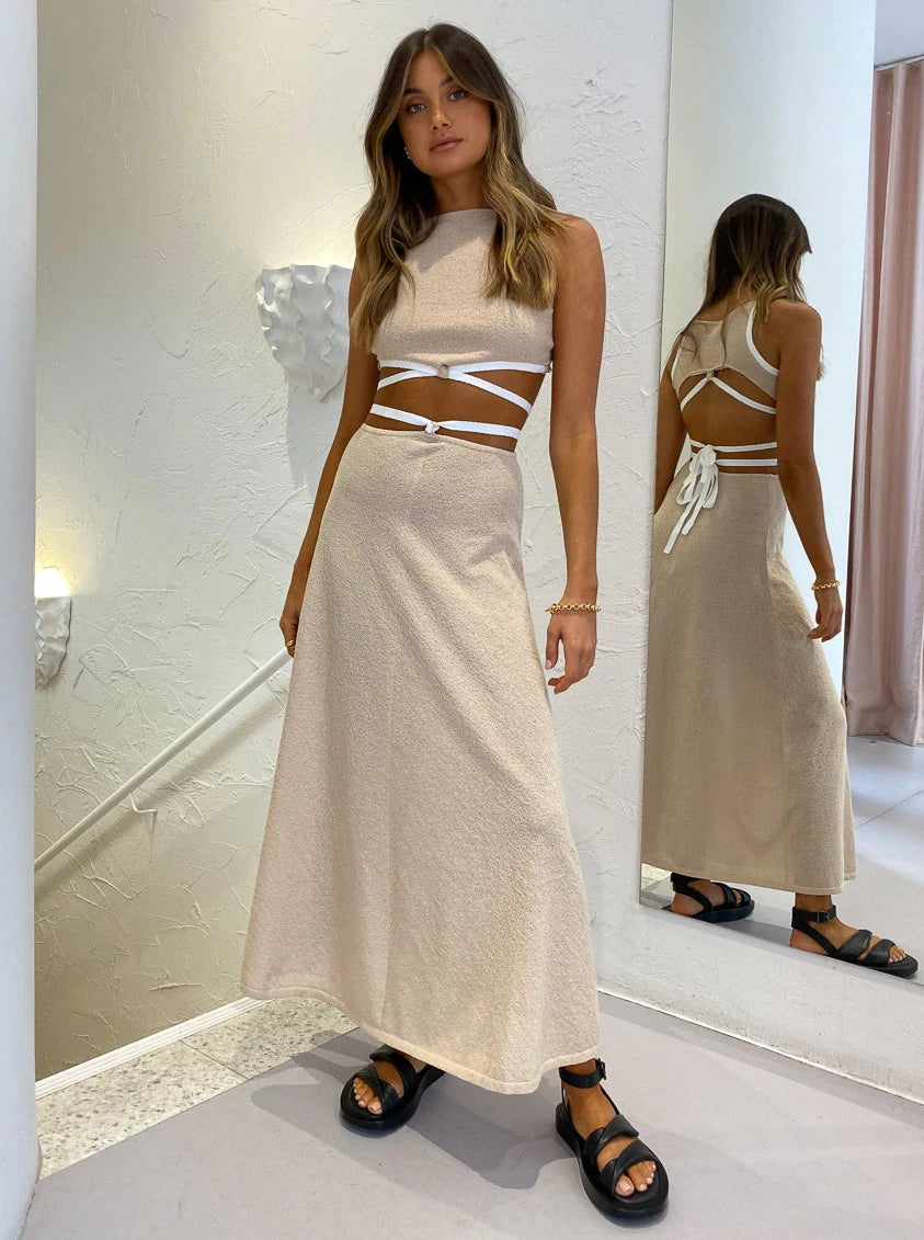 Bec and Bridge Lauren Knit Set in Cream for hire. Sleeveless, maxi length with open back cut out.