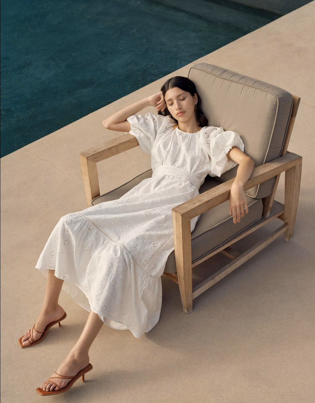 Aje Silvatica Broderie Midi Dress. White midi dress with short puff sleeves.