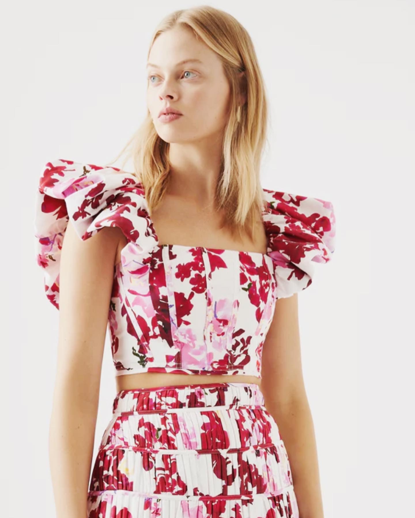 Aje Margot Bubble Sleeve Top. Pink floral crop top with frill sleeves.