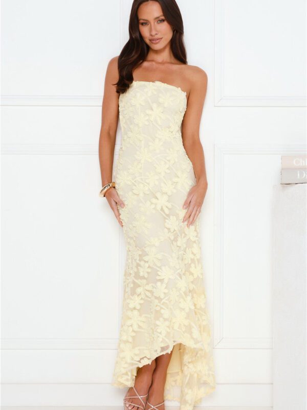 Woman wearing Urban Petal strapless floral maxi dress, high-low hem, wedding guest and cocktail event style