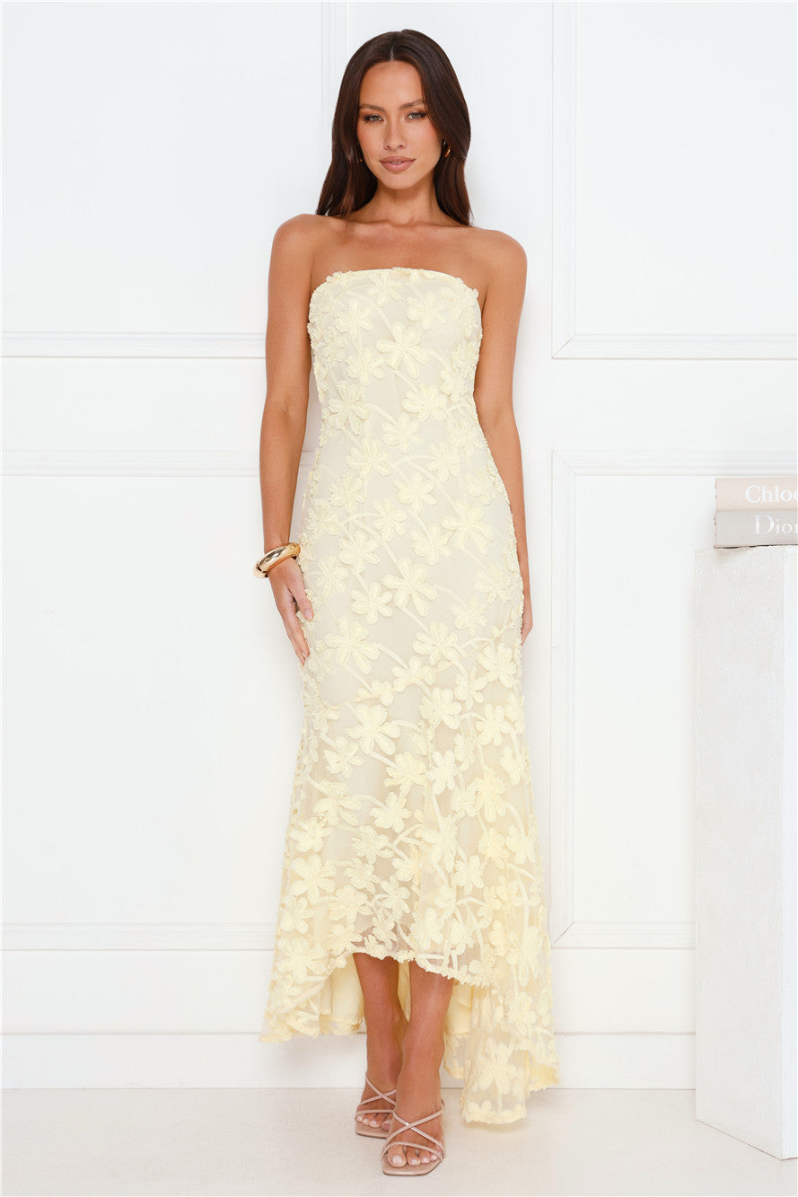 Woman wearing Urban Petal strapless floral maxi dress, high-low hem, wedding guest and cocktail event style