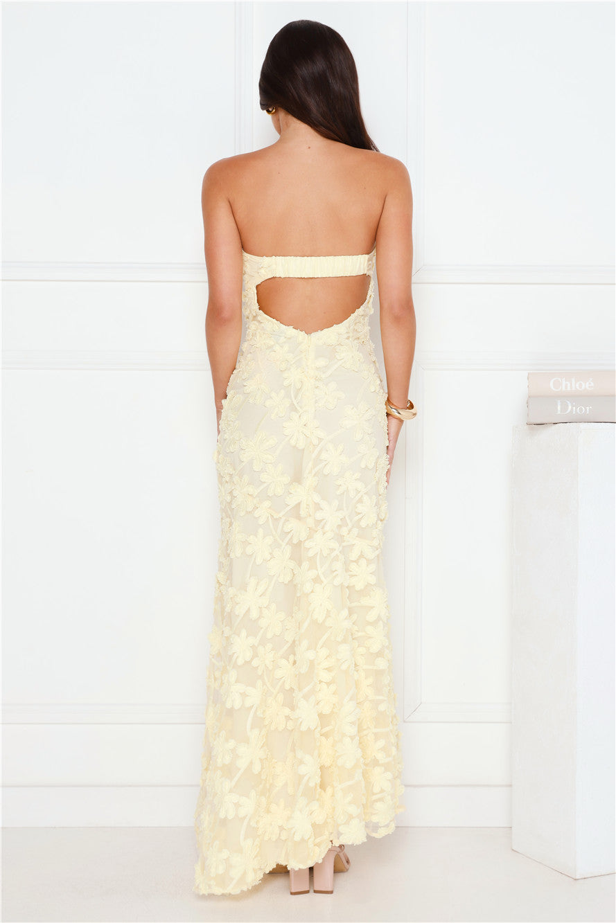 Woman wearing Urban Petal strapless floral maxi dress, high-low hem, wedding guest and cocktail event style